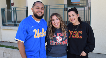 LAMC Staff members wearing a UCLA jersey, a CSUN sweater, and a USC sweater