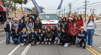A group of LAMC students, faculty, and staff that the Pacoima Holiday Parade