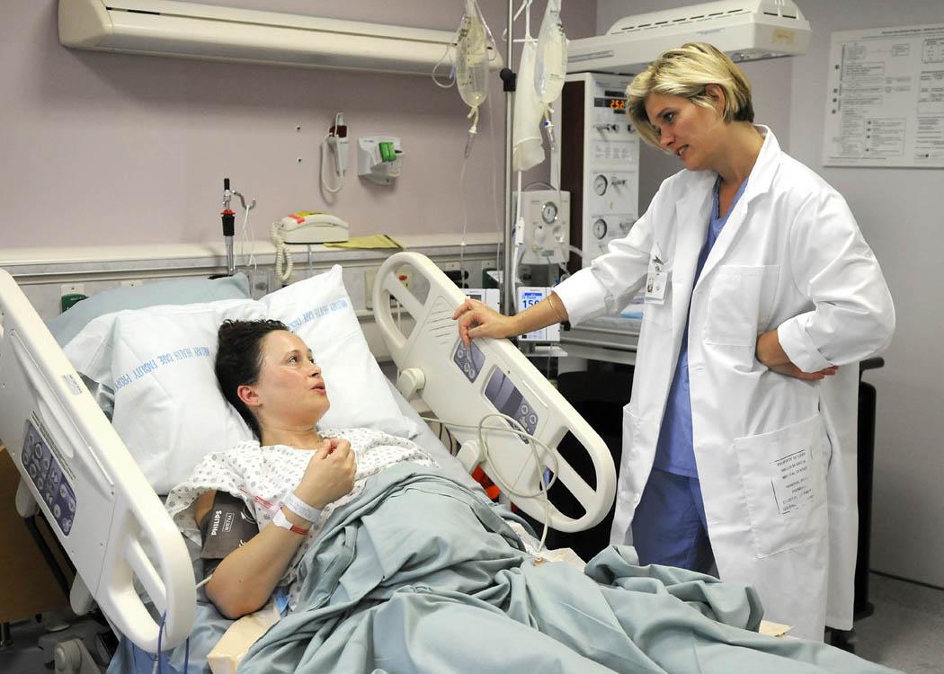 Doctor Attending to a Bedridden Patient