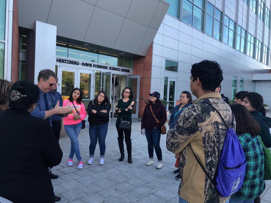 Professor and Students Outside of Science Center